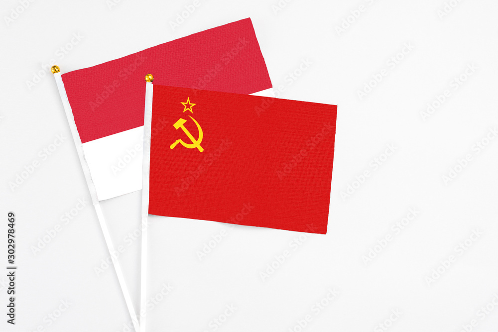 Soviet Union and Monaco stick flags on white background. High quality fabric, miniature national flag. Peaceful global concept.White floor for copy space. Soviet Union and Monaco stick flags on white background. High quality fabric, miniature national flag. Peaceful global concept.White floor for copy space.