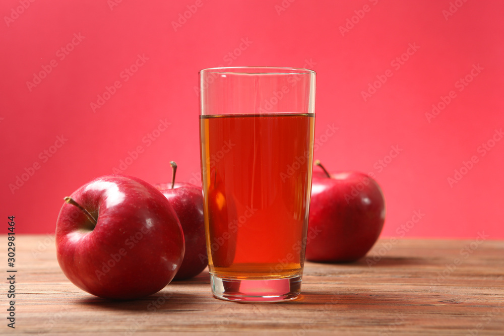apple juice from red apples on the table. 