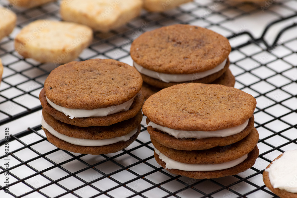 Ginger Cookies with Frosting on a Cooling Rack Ginger Cookies with Frosting on a Cooling Rack