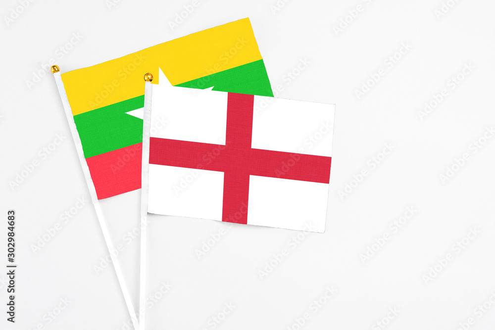 England and Myanmar stick flags on white background. High quality fabric, miniature national flag. Peaceful global concept.White floor for copy space.