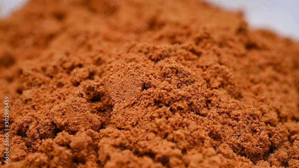 side view herb medicine RouGuiFen or Cinnamomi Cortex or Cassia Bark powder rotate and pause side view herb medicine RouGuiFen or Cinnamomi Cortex or Cassia Bark powder rotate and pause