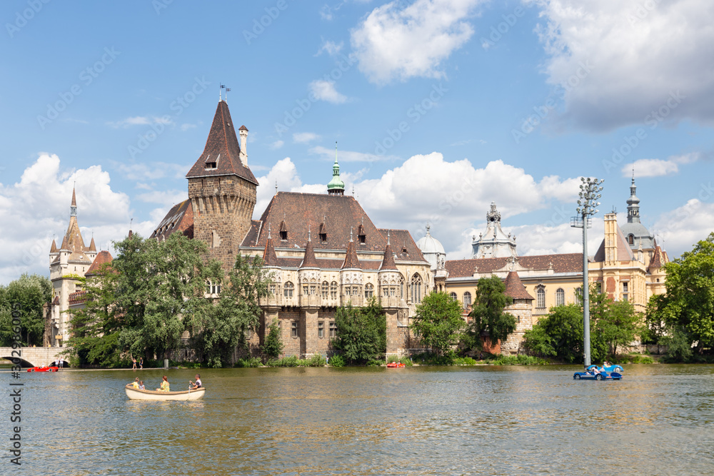 Budapest Vajdahunyad Castle with people with blurred faces in boats