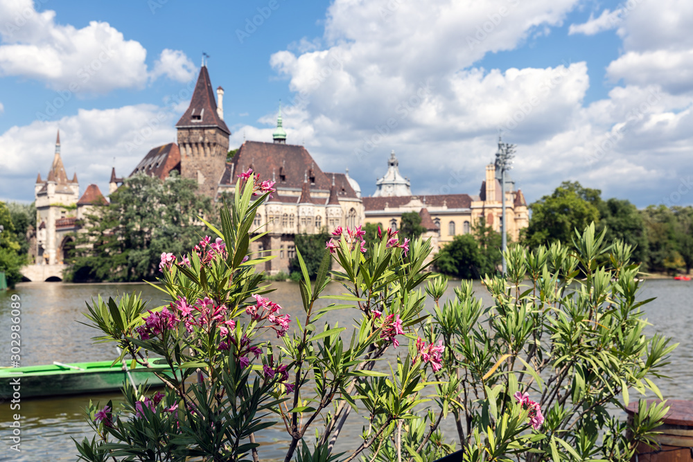 Budapest Vajdahunyad Castle with people with with oleander flowers