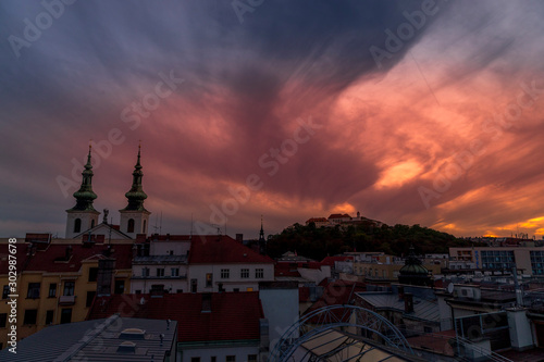 Castle Spilberk Brno Europe, Czech city, moving colored orange and blue clouds and sky with view on the area around the castle and church day to night capture.
