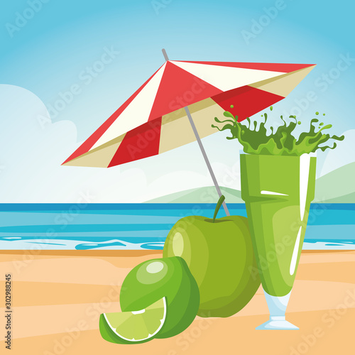 green fruits and juice glass at the beach