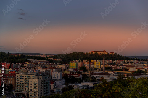 Castle Spilberk time-lapse captured in wide before sunset and castle turn on red light view in Brno city streets with building and surround area. © Lukas