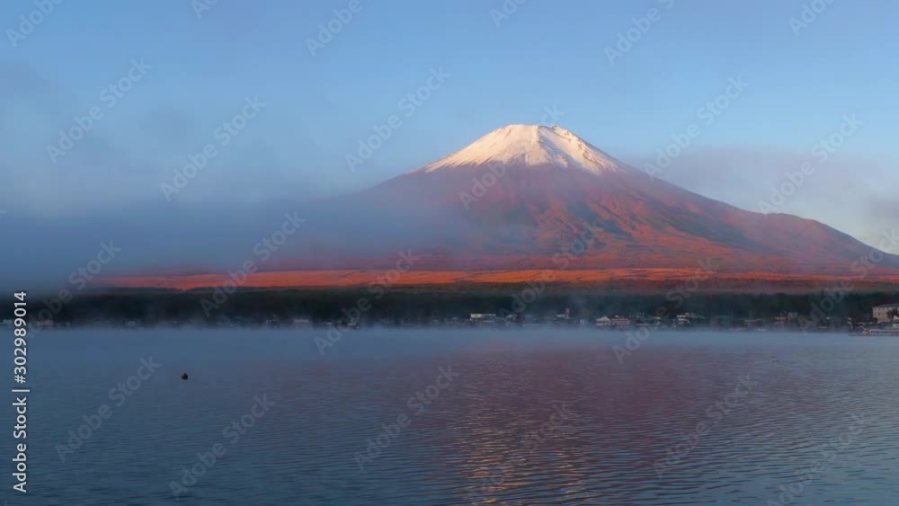 Timelapse landscape of Fuji Mountain with fog and white swan in the morning at Yamanaka Lake, Yamanashi, Japan Timelapse landscape of Fuji Mountain with fog and white swan in the morning at Yamanaka Lake, Yamanashi, Japan