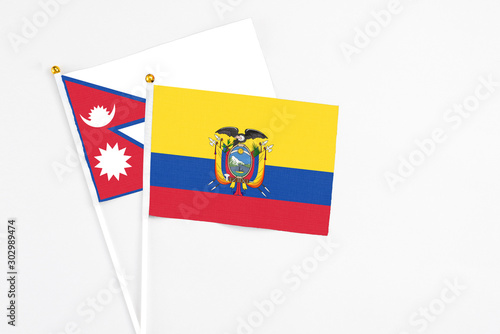 Free Download Ecuador and Nepal stick flags on white background. High quality fabric, miniature national flag. Peaceful global concept.White floor for copy space. - GFXLoad
