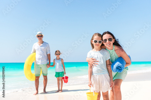 Happy beautiful family with kids on the beach © travnikovstudio