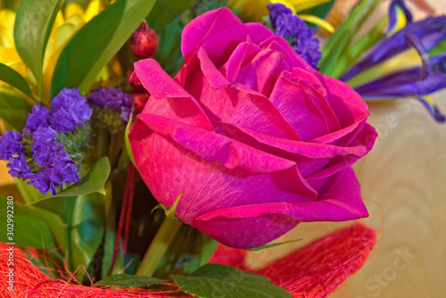 Red rose flower in a bouquet.