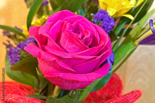 Red rose flower in a bouquet.