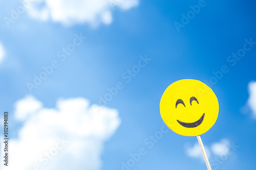 KYIV, UKRAINE - MAY 25, 2019: paper cut smiling emoji