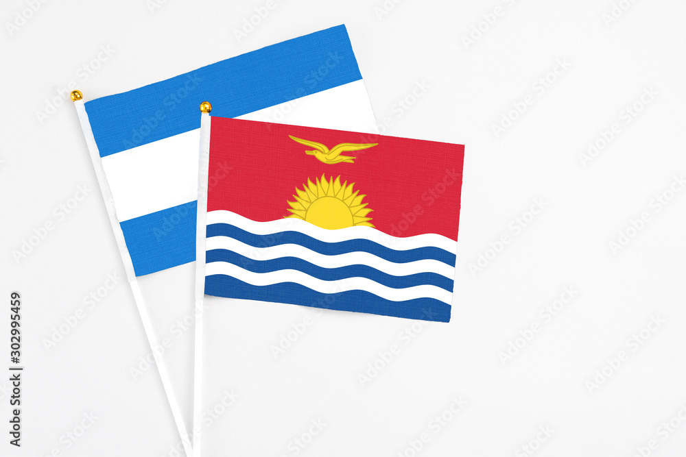 Naklejka premium Kiribati and Nicaragua stick flags on white background. High quality fabric, miniature national flag. Peaceful global concept.White floor for copy space.