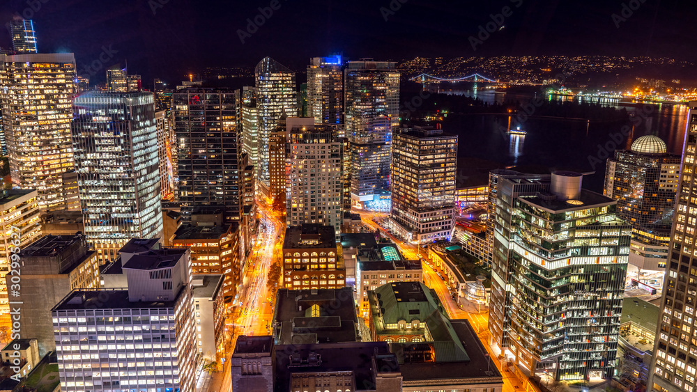 Fototapeta premium Vancouver, British Columbia, Canada. Aerial city view of downtown, taken during a chill night after a beautiful sunset.