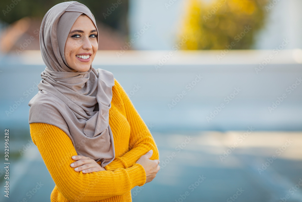 Muslim woman wearing hijab with a happy face standing and smiling with a  confident smile showing teeth. Muslim women with smiling face. Beautiful  middle eastern woman wearing abaya Stock-Foto | Adobe Stock
