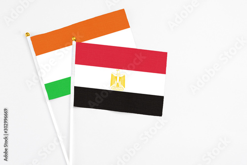 Free Download Egypt and Niger stick flags on white background. High quality fabric, miniature national flag. Peaceful global concept.White floor for copy space. - GFXLoad