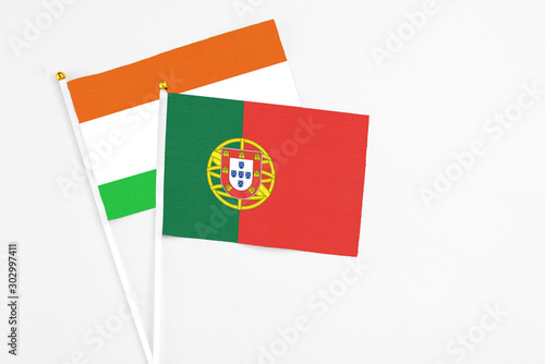 Portugal and Niger stick flags on white background. High quality fabric, miniature national flag. Peaceful global concept.White floor for copy space. Free Download Portugal and Niger stick flags on white background. High quality fabric, miniature national flag. Peaceful global concept.White floor for copy space. - GFXLoad