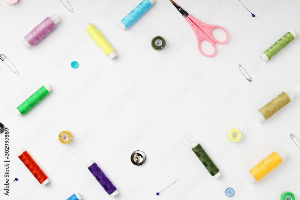 White background with different tools for sewing and tailoring White background with different tools for sewing and tailoring