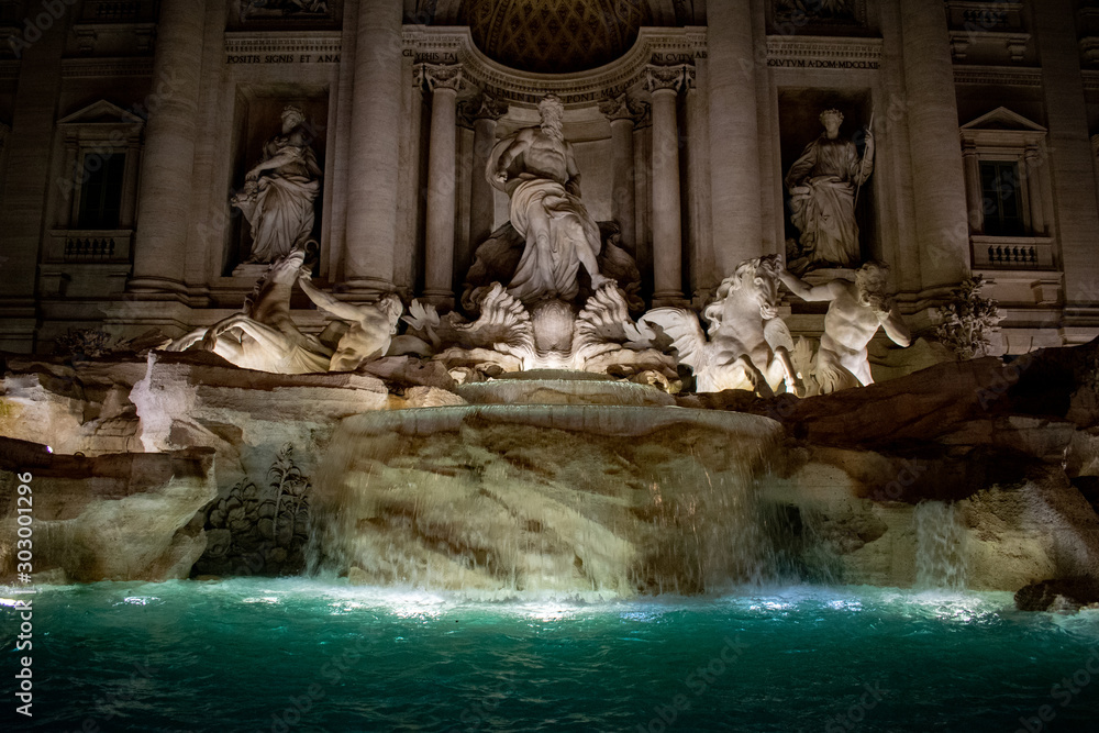 trevi fountain in rome in the night, itali with light on background