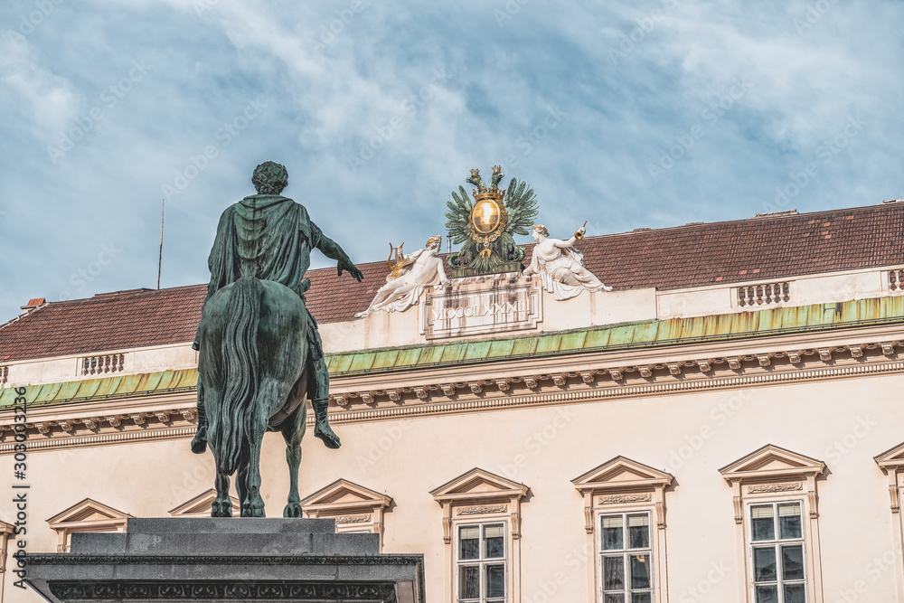 Fototapeta premium Kaiser statue in Josefplatz facing palais palffy in Vienna near