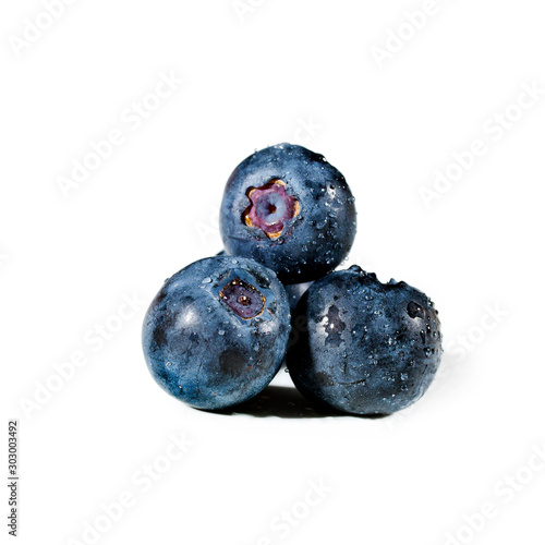 Blueberry with waterdrops isolated on a white background.