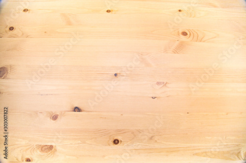 Background of brown pine Board with knots of bright wood structure. Backgrounds, structures, designs.