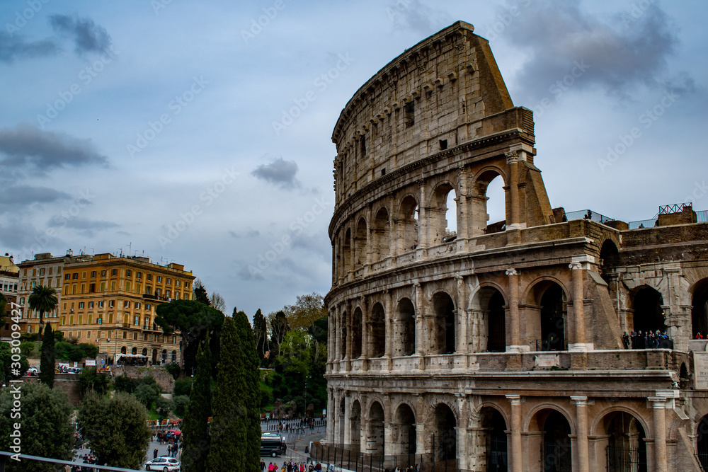 colosseum in rome with cloud in the background