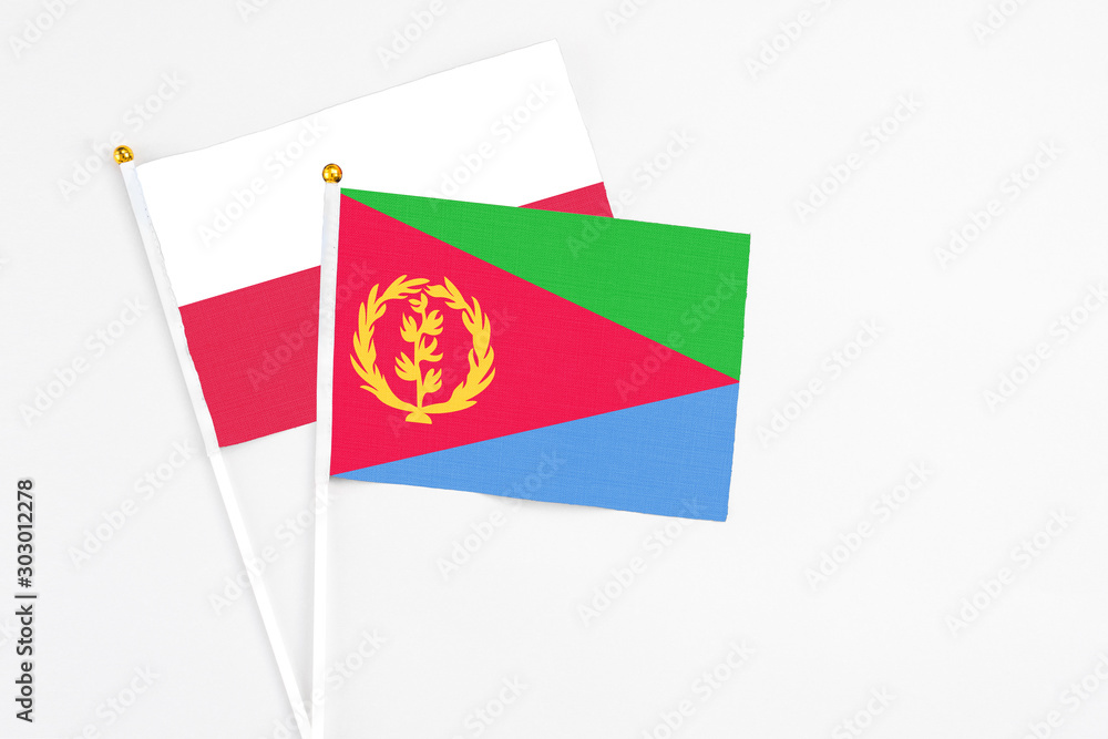 Eritrea and Poland stick flags on white background. High quality fabric, miniature national flag. Peaceful global concept.White floor for copy space. Eritrea and Poland stick flags on white background. High quality fabric, miniature national flag. Peaceful global concept.White floor for copy space.