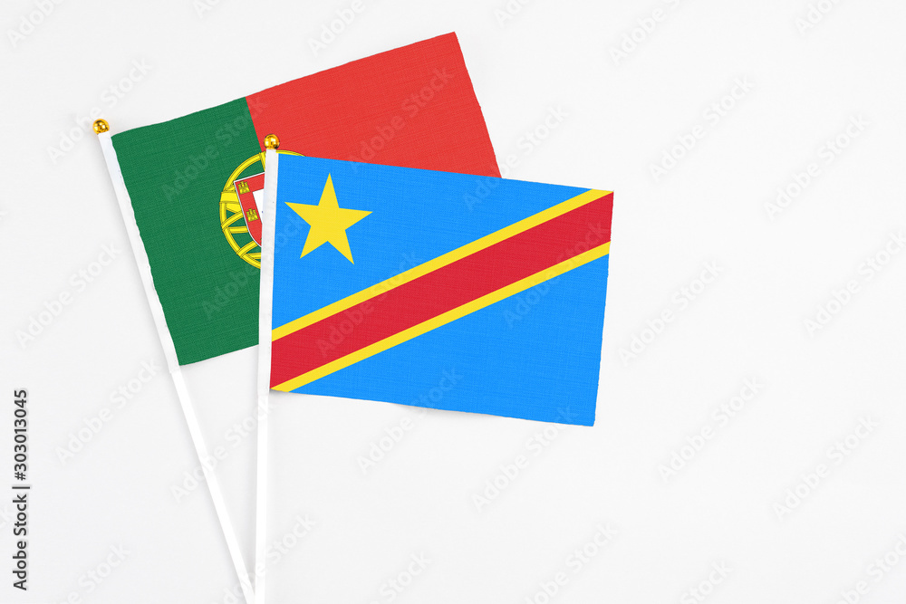 Congo and Portugal stick flags on white background. High quality fabric, miniature national flag. Peaceful global concept.White floor for copy space. Congo and Portugal stick flags on white background. High quality fabric, miniature national flag. Peaceful global concept.White floor for copy space.