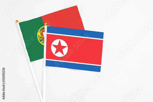 North Korea and Portugal stick flags on white background. High quality fabric, miniature national flag. Peaceful global concept.White floor for copy space. Free Download North Korea and Portugal stick flags on white background. High quality fabric, miniature national flag. Peaceful global concept.White floor for copy space. - GFXLoad