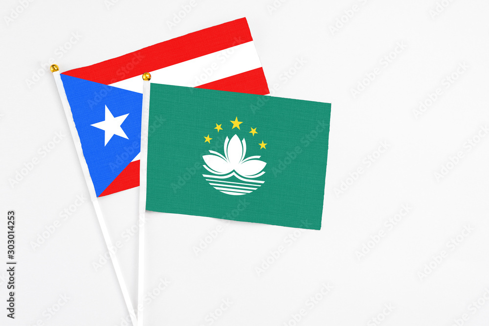 Macao and Puerto Rico stick flags on white background. High quality fabric, miniature national flag. Peaceful global concept.White floor for copy space. Macao and Puerto Rico stick flags on white background. High quality fabric, miniature national flag. Peaceful global concept.White floor for copy space.