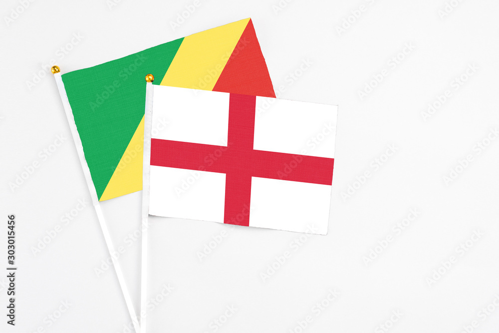 England and Republic Of The Congo stick flags on white background. High quality fabric, miniature national flag. Peaceful global concept.White floor for copy space.