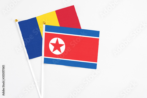 North Korea and Romania stick flags on white background. High quality fabric, miniature national flag. Peaceful global concept.White floor for copy space. Free Download North Korea and Romania stick flags on white background. High quality fabric, miniature national flag. Peaceful global concept.White floor for copy space. - GFXLoad