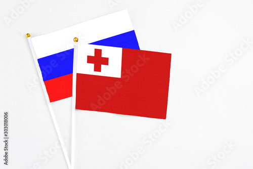 Free Download Tonga and Russia stick flags on white background. High quality fabric, miniature national flag. Peaceful global concept.White floor for copy space. - GFXLoad