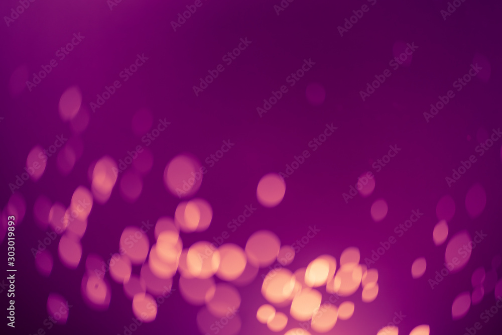 Dark Purple Festive Christmas Beautiful abstract Background with bokeh lights. Holiday Texture with copy space. Can be used as Wallpaper, filling for a website, defocused