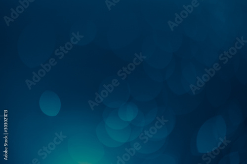 dark blue Festive Christmas Beautiful abstract Background with bokeh lights. Holiday Texture with copy space. Can be used as Wallpaper, filling for a website, defocused