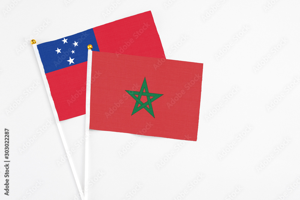Morocco and Samoa stick flags on white background. High quality fabric, miniature national flag. Peaceful global concept.White floor for copy space. Morocco and Samoa stick flags on white background. High quality fabric, miniature national flag. Peaceful global concept.White floor for copy space.