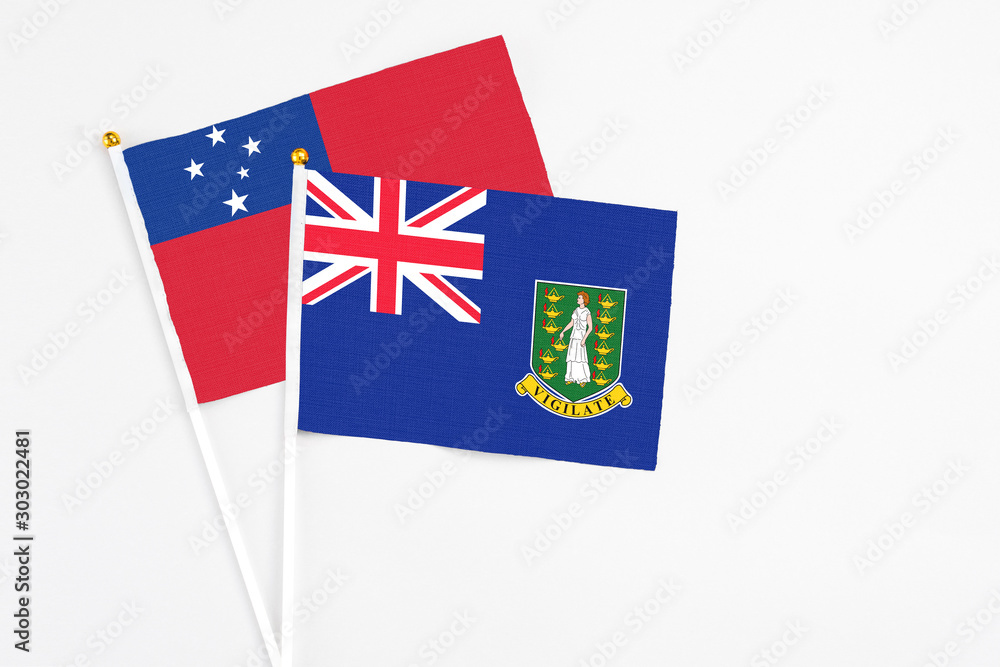 Fototapeta premium British Virgin Islands and Samoa stick flags on white background. High quality fabric, miniature national flag. Peaceful global concept.White floor for copy space.