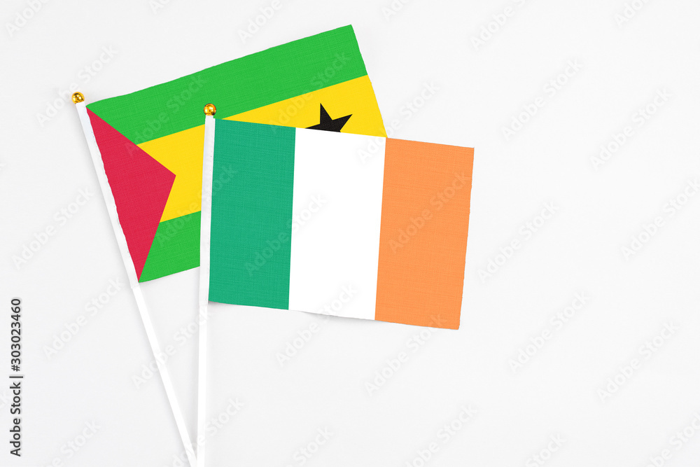 Ireland and Sao Tome And Principe stick flags on white background. High quality fabric, miniature national flag. Peaceful global concept.White floor for copy space. Ireland and Sao Tome And Principe stick flags on white background. High quality fabric, miniature national flag. Peaceful global concept.White floor for copy space.