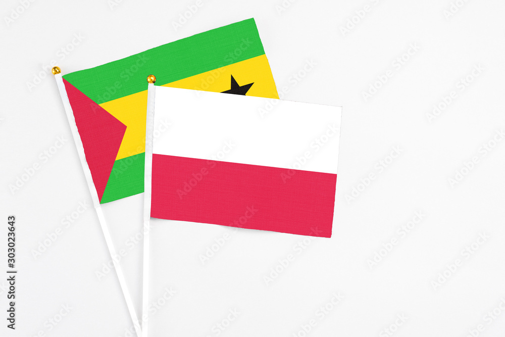 Poland and Sao Tome And Principe stick flags on white background. High quality fabric, miniature national flag. Peaceful global concept.White floor for copy space. Poland and Sao Tome And Principe stick flags on white background. High quality fabric, miniature national flag. Peaceful global concept.White floor for copy space.