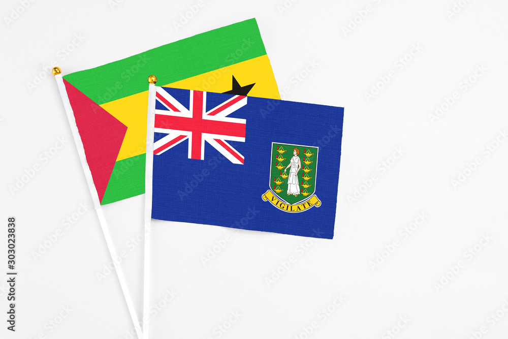 Fototapeta premium British Virgin Islands and Sao Tome And Principe stick flags on white background. High quality fabric, miniature national flag. Peaceful global concept.White floor for copy space.