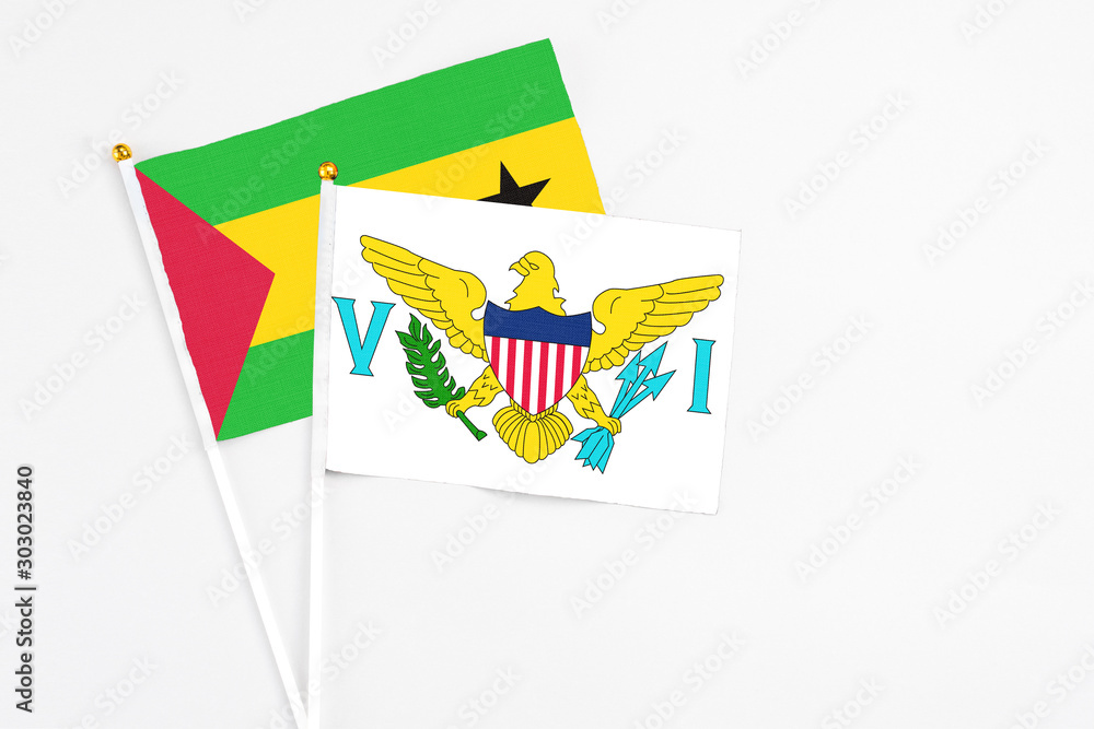 United States Virgin Islands and Sao Tome And Principe stick flags on white background. High quality fabric, miniature national flag. Peaceful global concept.White floor for copy space. United States Virgin Islands and Sao Tome And Principe stick flags on white background. High quality fabric, miniature national flag. Peaceful global concept.White floor for copy space.