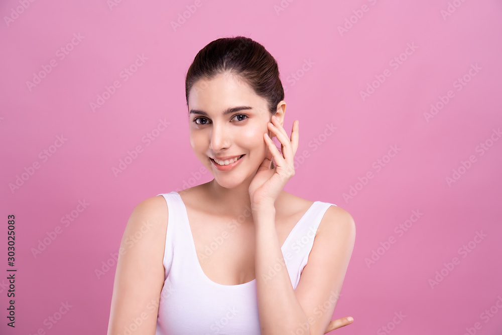 Beautiful Young Mix Asian Caucasian woman with clean fresh white skin touching face with fingers softly in beauty pose. Facial treatment, cosmetic, spa, make up and surgery advertisement Beautiful Young Mix Asian Caucasian woman with clean fresh white skin touching face with fingers softly in beauty pose. Facial treatment, cosmetic, spa, make up and surgery advertisement