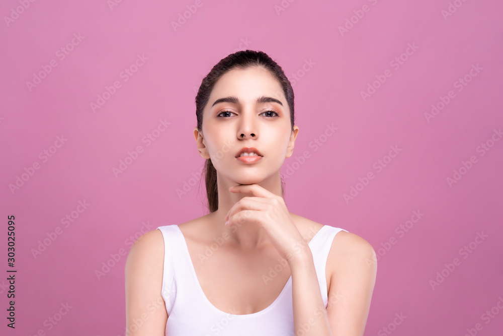 Beautiful Young Mix Asian Caucasian woman with clean fresh white skin touching face with fingers softly in beauty pose. Facial treatment, cosmetic, spa, make up and surgery advertisement Beautiful Young Mix Asian Caucasian woman with clean fresh white skin touching face with fingers softly in beauty pose. Facial treatment, cosmetic, spa, make up and surgery advertisement