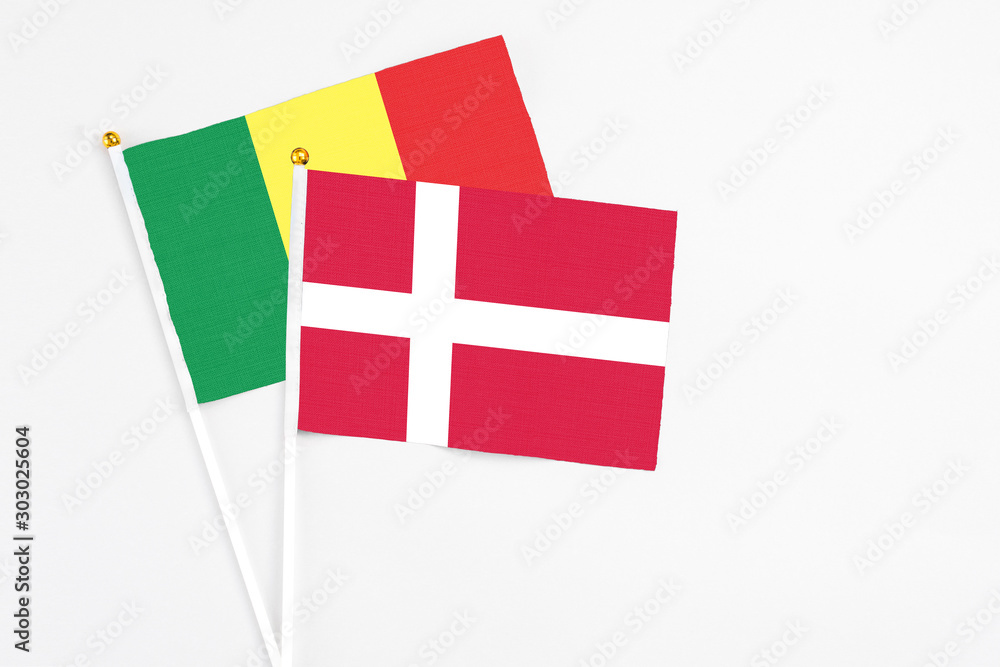 Denmark and Senegal stick flags on white background. High quality fabric, miniature national flag. Peaceful global concept.White floor for copy space.