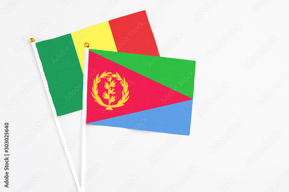 Eritrea and Senegal stick flags on white background. High quality fabric, miniature national flag. Peaceful global concept.White floor for copy space. Eritrea and Senegal stick flags on white background. High quality fabric, miniature national flag. Peaceful global concept.White floor for copy space.