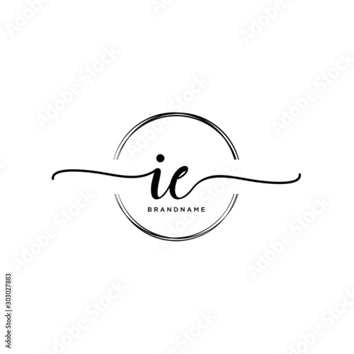 IE Initial handwriting logo with circle template vector. photo