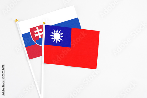Taiwan and Slovakia stick flags on white background. High quality fabric, miniature national flag. Peaceful global concept.White floor for copy space. Free Download Taiwan and Slovakia stick flags on white background. High quality fabric, miniature national flag. Peaceful global concept.White floor for copy space. - GFXLoad