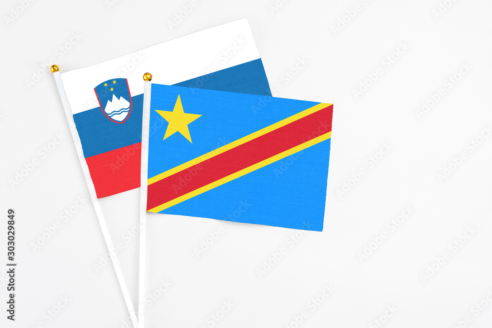 Congo and Slovenia stick flags on white background. High quality fabric, miniature national flag. Peaceful global concept.White floor for copy space. Congo and Slovenia stick flags on white background. High quality fabric, miniature national flag. Peaceful global concept.White floor for copy space.