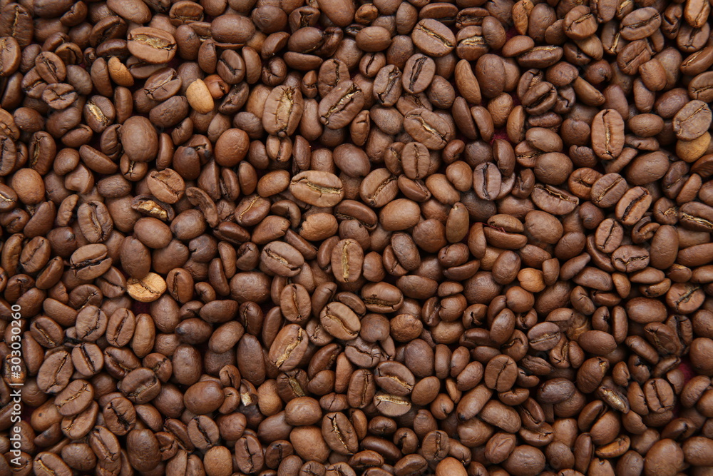 roasted coffee beans background. Arabica. Ingredient. Flat lay. Top view. Pattern, background, texture. Coffee concept. roasted coffee beans background. Arabica. Ingredient. Flat lay. Top view. Pattern, background, texture. Coffee concept.